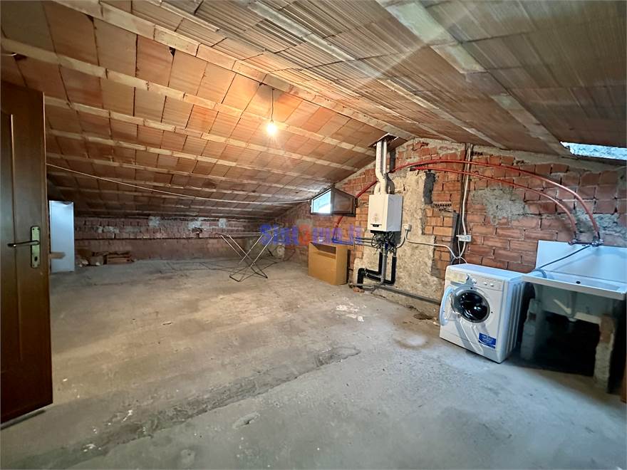 Mansarda con lavanderia